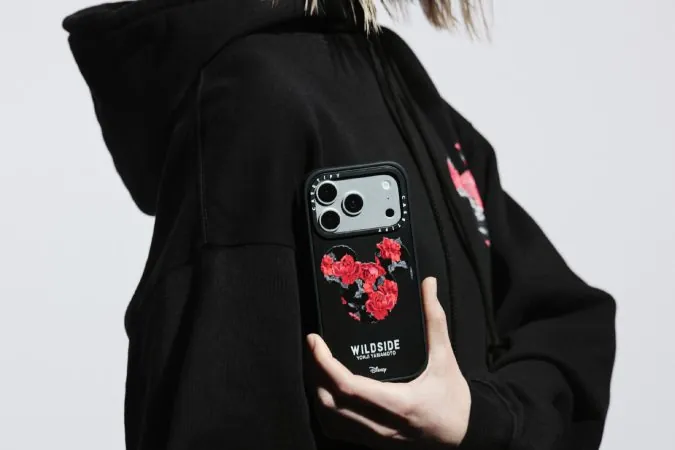 CASETiFY × WILDSIDE case worn with a black hoodie