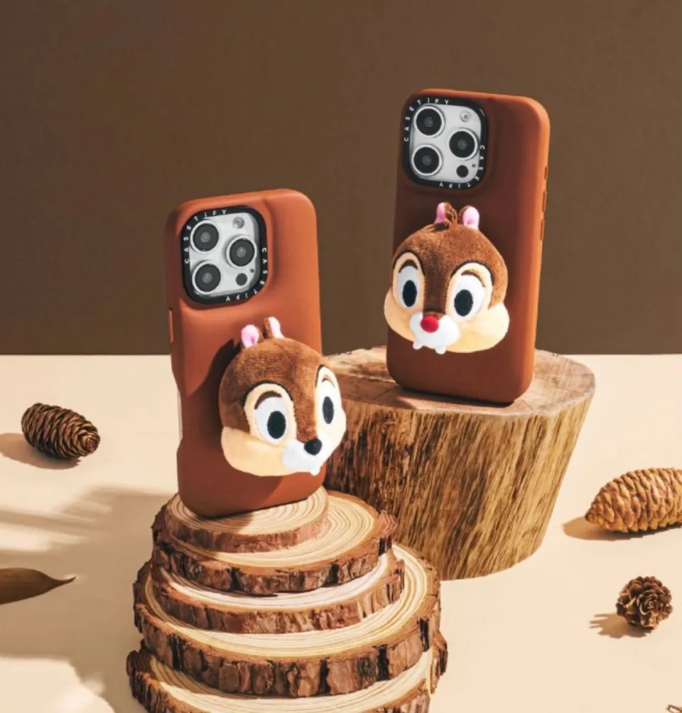 Chip and Dale plush-face cases on a wooden stump