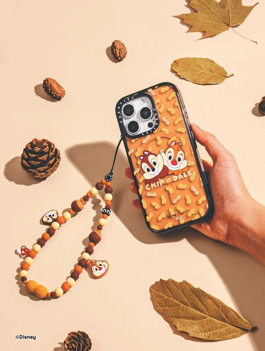 Orange Chip ’n’ Dale case with beaded charm in hand