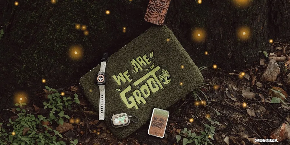 We Are Groot accessories and laptop sleeve in a woodland scene with fireflies