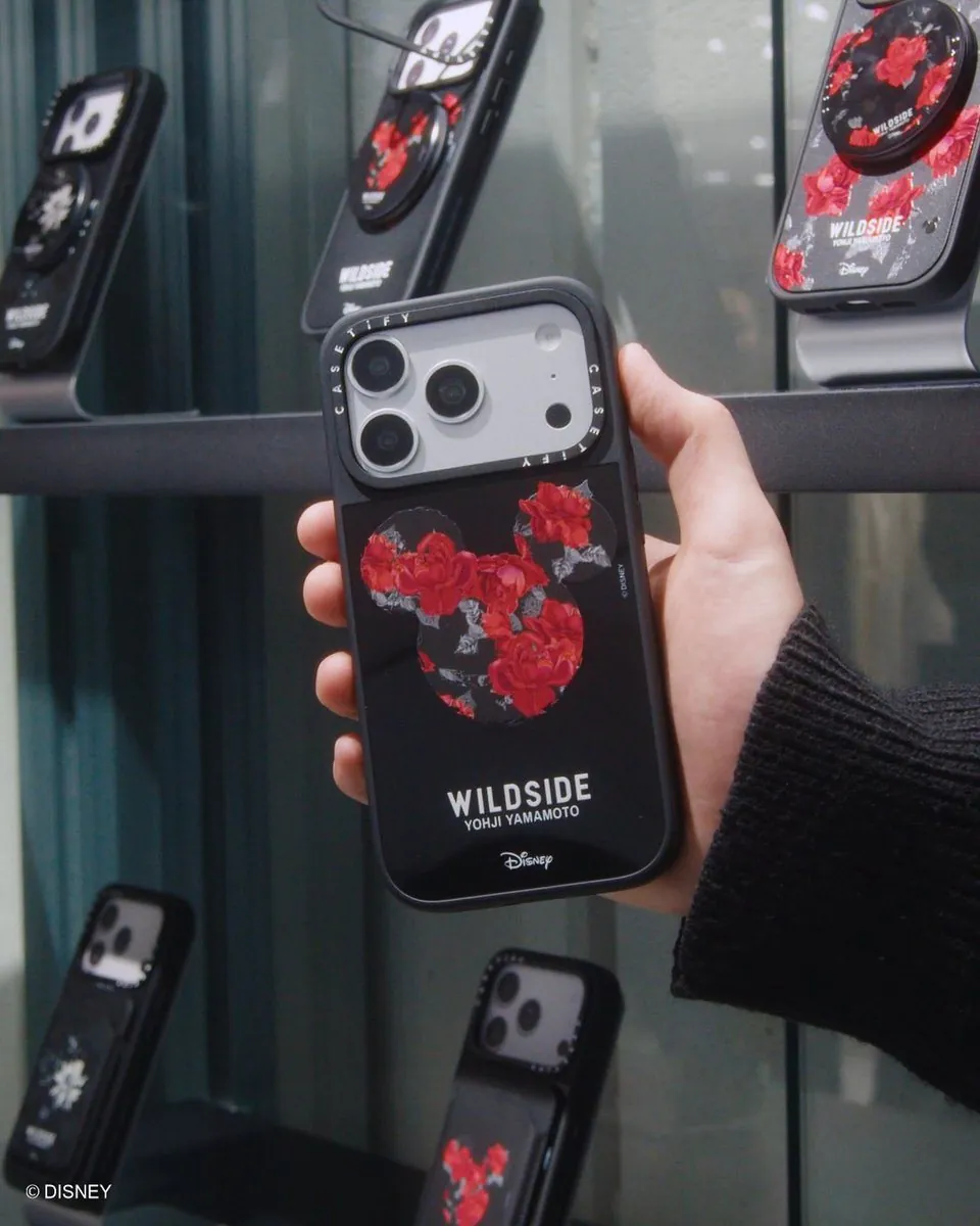 CASETiFY × WILDSIDE × Disney phone case with red Mickey rose pattern, in hand