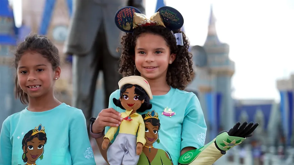 Elisa at Magic Kingdom wearing her Tiana-inspired Open Bionics Hero Arm