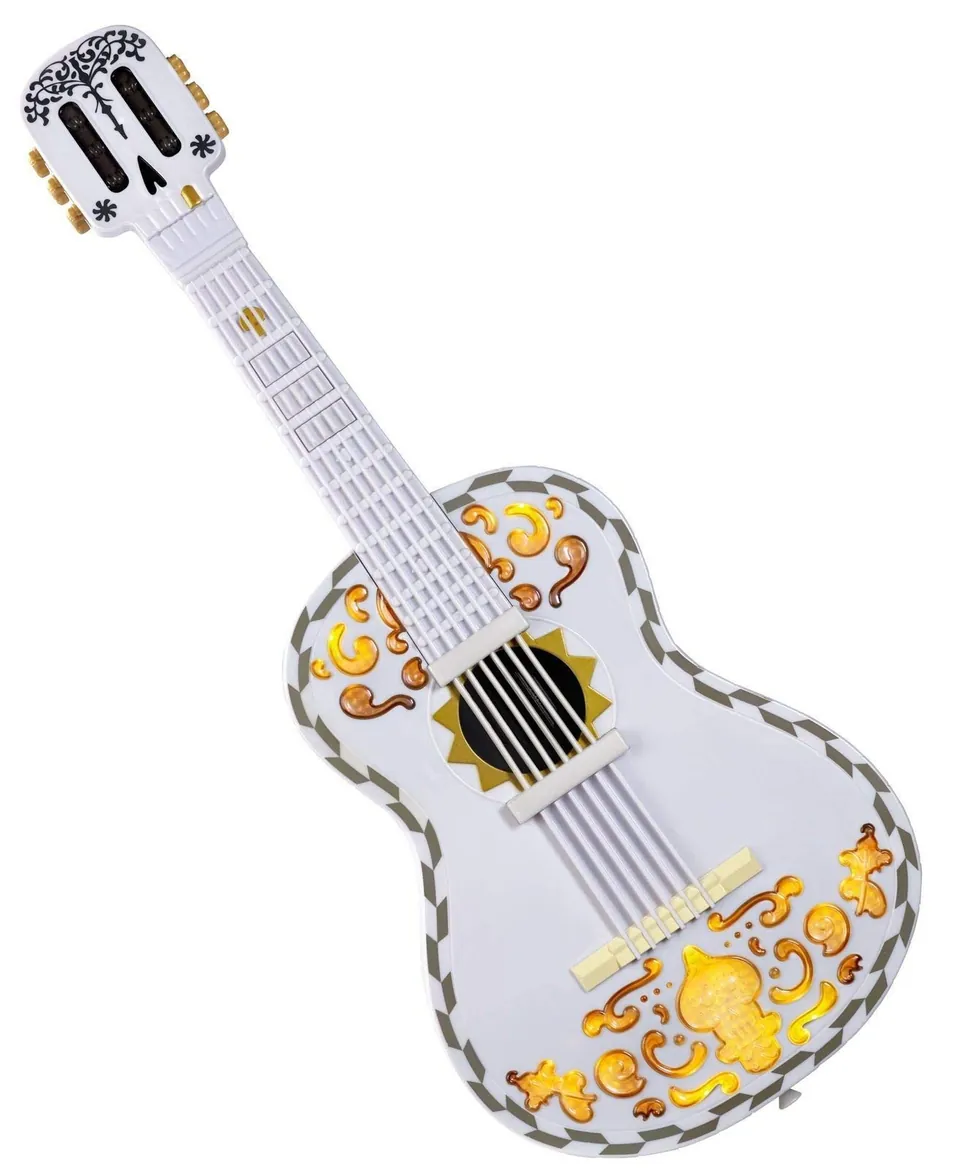 Mattel Coco guitar — white skull-headstock guitar with lit-up gold scrollwork