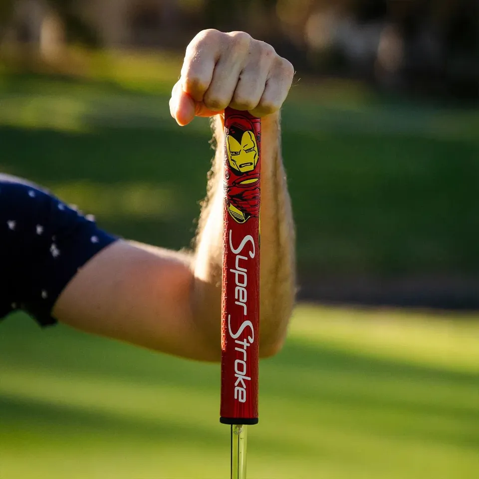 Iron Man SuperStroke grip installed on a putter, held up on the green
