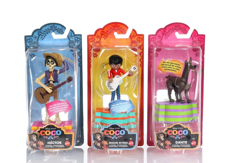 Coco figures — Héctor, Miguel and Dante — in papel picado packaging